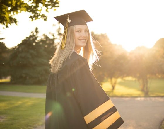 Maya in her cap and gown on graduation day